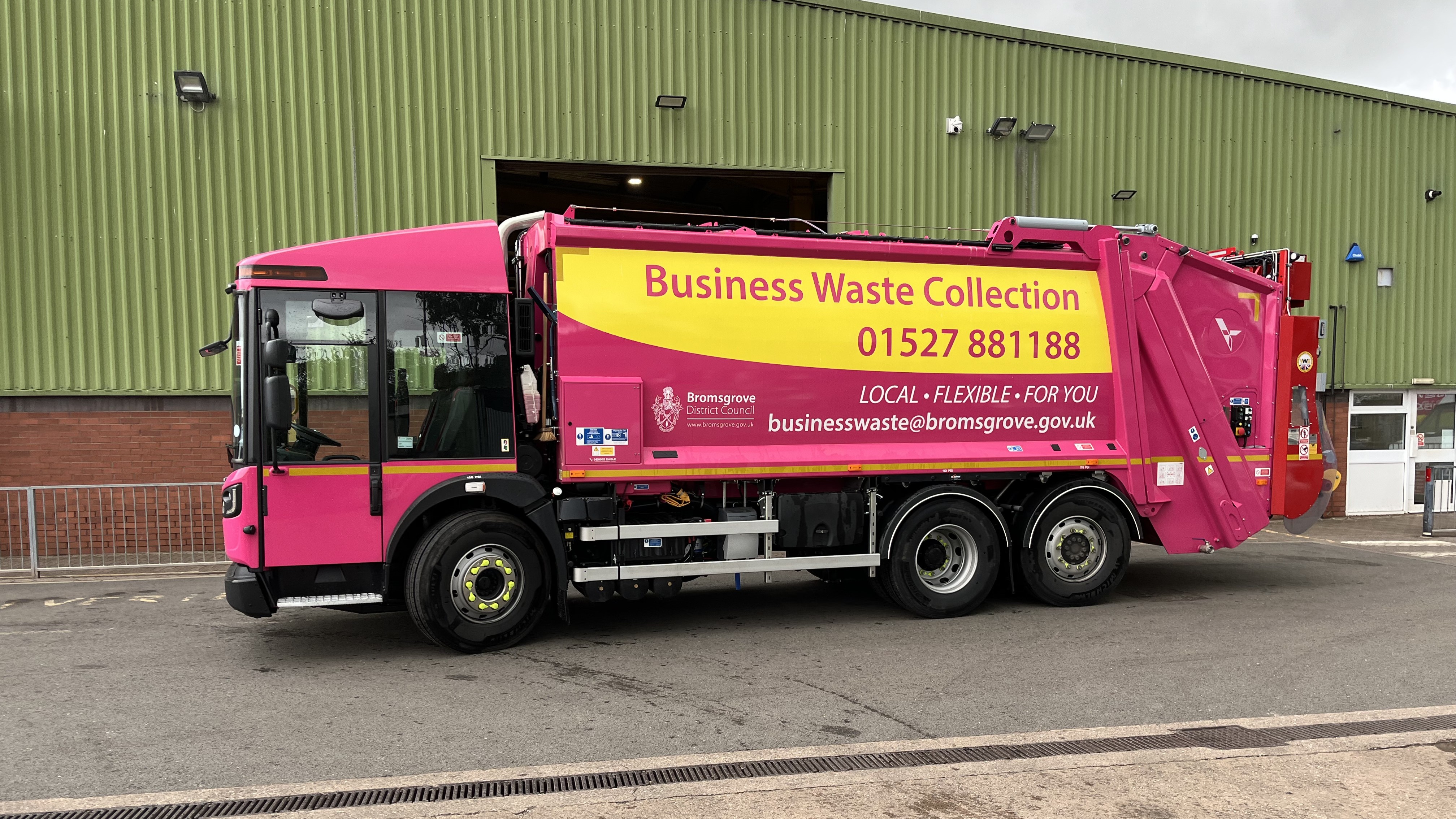 Image shows the new pink recycling lorry at the depot