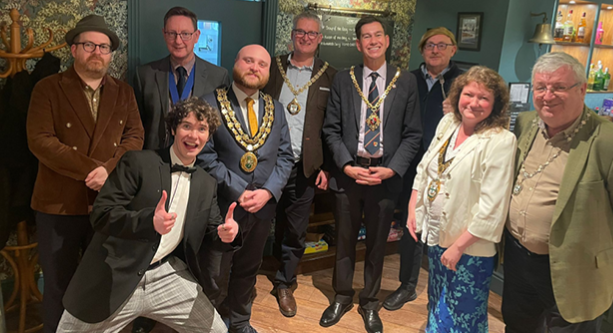 Image of BDC Chairman and guests at comedy fundraiser