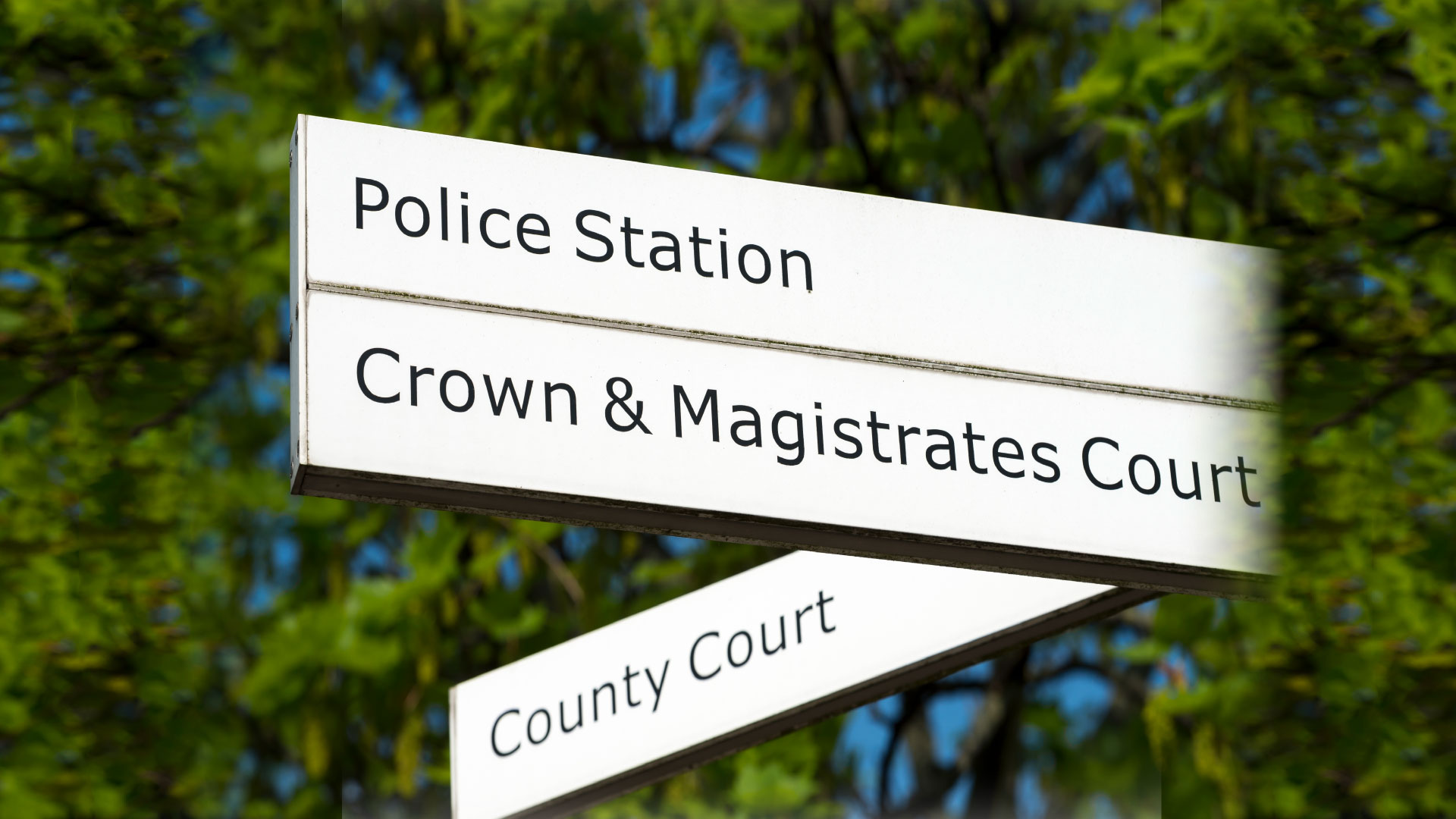 A sign with the text 'magistrates court'